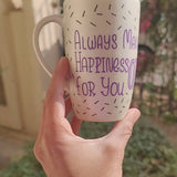 A white pearl hand painted mug with the words 