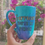 A Hand painted blue mug with the words 