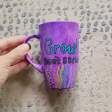 A Purple hand painted mug with the words 