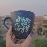 A Shimmery blue hand painted mug with the words 