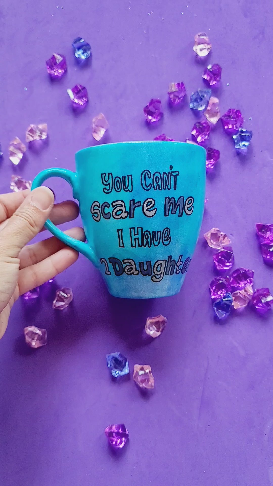 A Blue hand painted mug with the words "You cant scare me I have 2 daughter" and the other side has the name "Butcher"