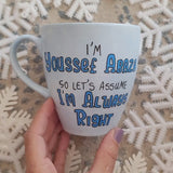 A baby blue hand painted mug with the words 