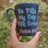 a Bluish galaxy hand painted mug with the words 