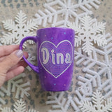 A Purple Galaxy hand-painted mug with a heart painted and the name 