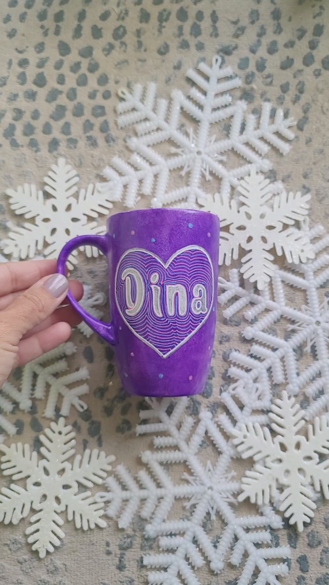 A Purple Galaxy hand-painted mug with a heart painted and the name "Dina" written inside in silver. and on the other side the sentence :You are my Everything, I Love you"