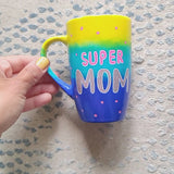 A Gradient colored mug (Yellow blue and ultramarine) with the words 