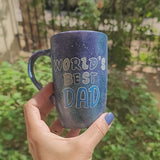 A black galaxy hand painted mug with the sentence 