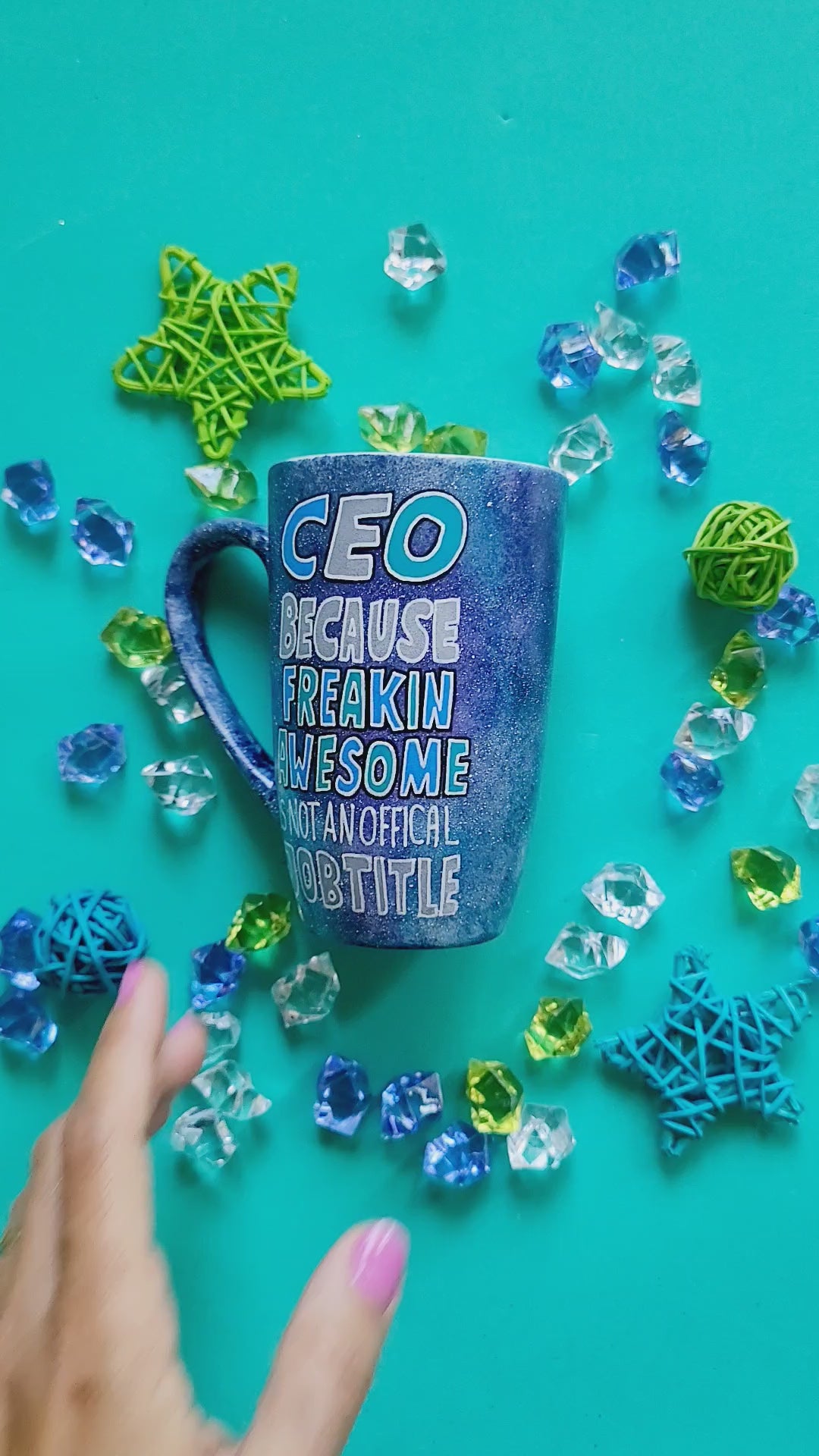 A bluish galaxy hand painted mug with the words "CEO because Freakin Awesome is not an official job title" and the other side has the name "Jacques"