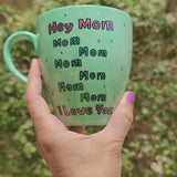 A mint Colored mug with the sentence 