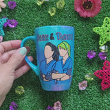 A Blue Hand painted mug with the words 