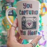 A pale pink mug with the words 