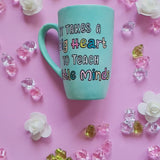 A Mint green handpainted mug with the words 