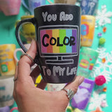 A hand-painted black mug with the words 