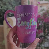 A hand painted pink galaxy mug with the sentence 