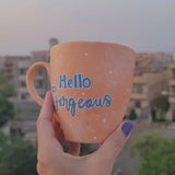 A Baby Orange Hand-painted mug with the words 