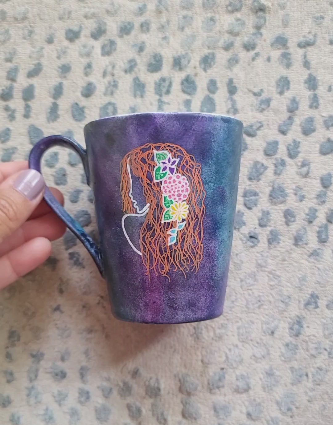 A video showing a dark sky colored mug with Virgo on one side and the name "Perry" on the other