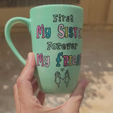 a mint green hand painted mug with the words 