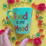 A green Galaxy hand painted mug with the words 