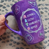 A Purple Galaxy Hand painted mug with the words 