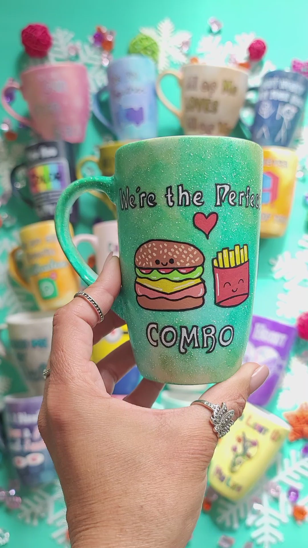 A hand-painted green galaxy mug with the words "we're the perfect combo"and then on the other side of the mug the name "sara" is written