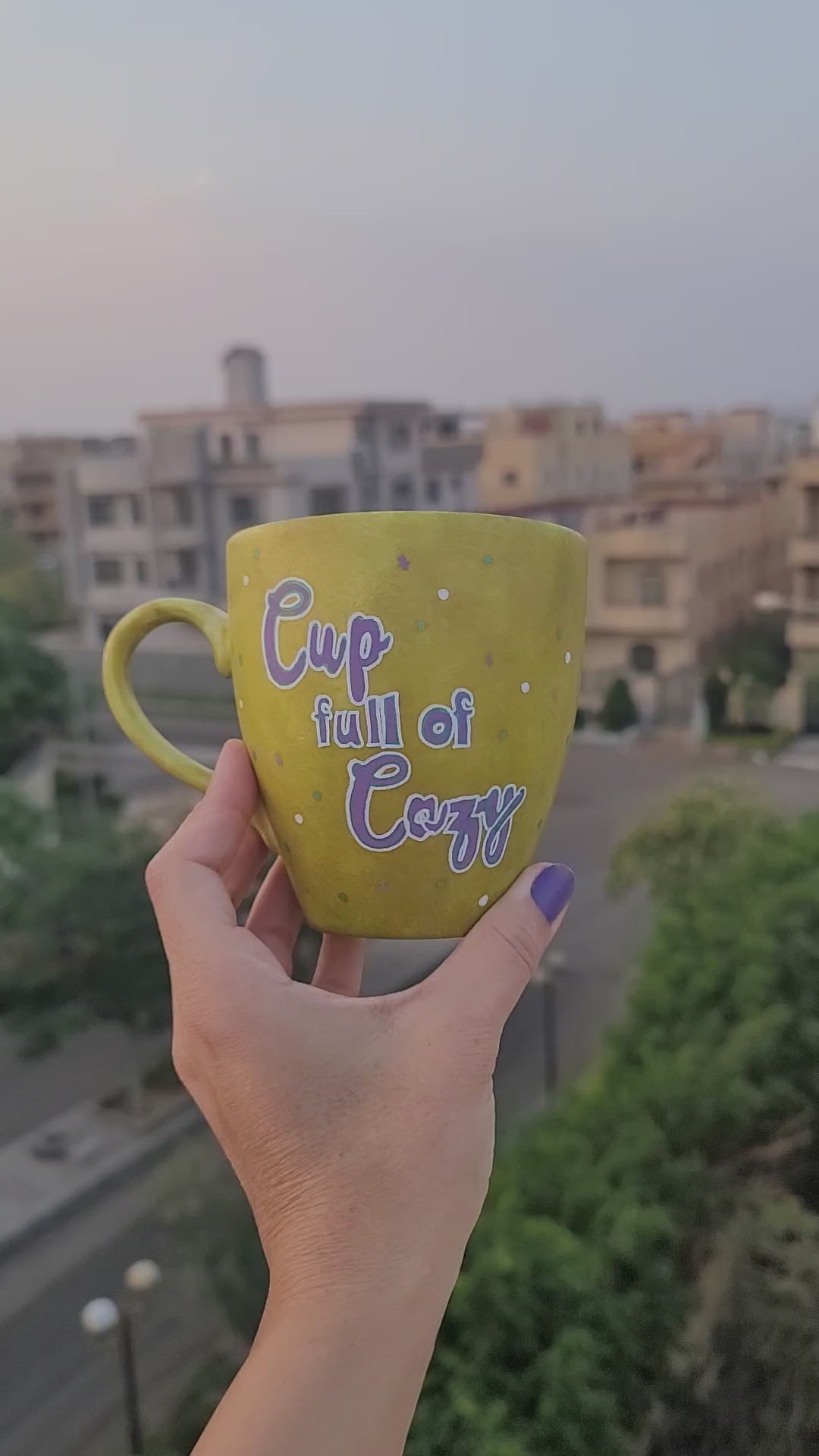 A Handpainted Greenish Bronze Mug with the sentence "Cup full of Cozy" in purple and a snowflake on the other side