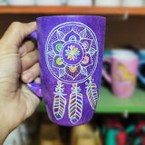 A Purple Galaxy hand painted mug with a dreamcatcher in white and colored in with (pink, yellow, purple blue, green and orange)