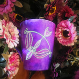 a hand-painted purple mug with a Sagittarius sign