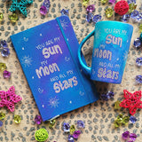 A Blue Galaxy Hand painted mug and notebook with the sentence 