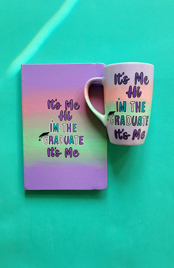 A Gradient hand painted mug and notebook (lilac-peach-mint-lilac) with the sentence "it's me ,Hi , I'm the Graduate it's me"