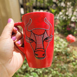 A hand-painted red black mug with Taurus sign