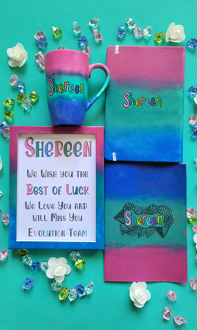 A Gift Set of a mug, notebook, wooden frame and card all painted in gradient colors of (pink-green-blue) . All with the name shereen