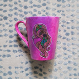 A hand-painted pink galaxy mug with Virgo sign