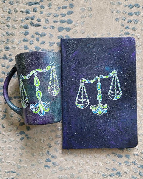 A Black galaxy hand painted mug and notebook with libra sign